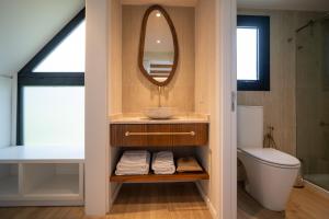 a bathroom with a sink and a mirror at Casa Pradera - Hotel Serrano in Sierra de los Padres