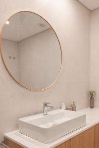 a bathroom with a white sink and a mirror at Conserveira 8 in Olhão +23 photos