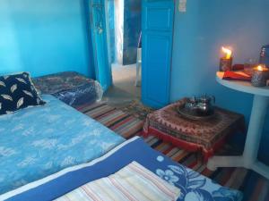 En eller flere senge i et værelse på La grotte Moulay Atlantique d'Aglou