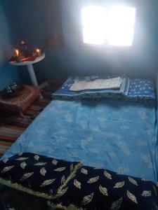 Postel nebo postele na pokoji v ubytování La grotte Moulay Atlantique d'Aglou