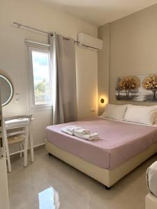 En eller flere senge i et værelse på Eva Ivoni apartments