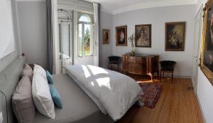 En eller flere senge i et værelse på Villa Lucia mit Pool in Gardone Riviera, Gardasee + 87 billeder