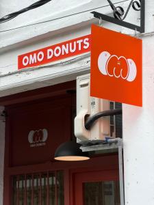 a one donuts sign on the side of a building at Aayu Seckchuan - 3 mins walk to Love Lane in George Town