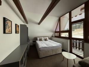 Postel nebo postele na pokoji v ubytování Arnika Hrabětice