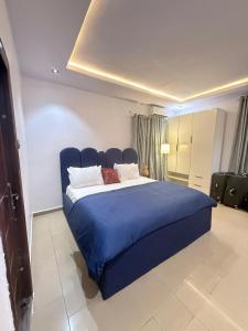 Giường trong phòng chung tại Bito luxury - Wuse ll