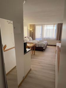 Postel nebo postele na pokoji v ubytování Ferienapartment TESLA im Wellnesshotel - Bayerischer Wald + 56 fotografií
