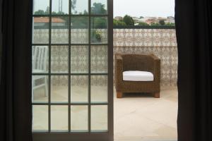 a view through an open window of a room at Cantinho da Celeste in Paramos
