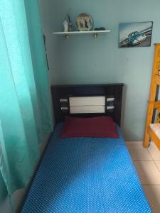 En eller flere senge i et værelse på Residencial savassi + 16 billeder