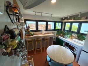 een keuken met een tafel en een keuken met een kerstboom bij Baan Rot Fai Krabi Platform 2 in Ao Nam Mao