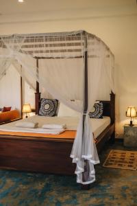 En eller flere senge i et værelse på My Home Villa