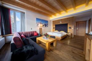 En eller flere senge i et værelse på Alpenresidenz Trisanna + 161 billeder