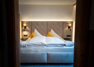 En eller flere senge i et værelse på Alpenresidenz Trisanna