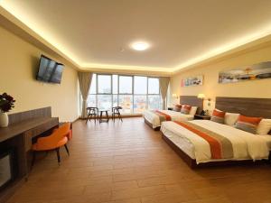 En eller flere senge i et værelse på SM HOTEL Plus