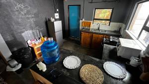 a kitchen with a counter with two plates on it at Zoko cottage in Maun