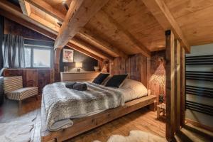 En eller flere senge i et værelse på Chalet ski-in avec vue MontBlanc et Bain nordique