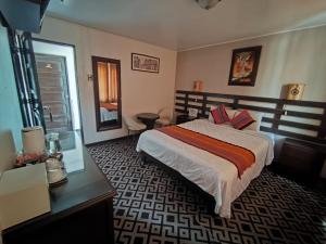 En eller flere senge i et værelse på SQ Estancia Del Inca + 73 billeder