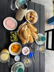 a table with plates of food on top at Casa Kahlo in Lençóis