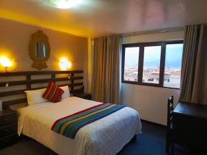 En eller flere senge i et værelse på SQ Estancia Del Inca + 45 billeder
