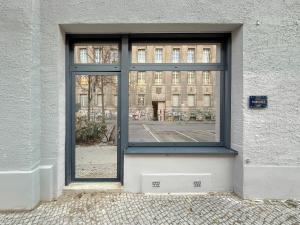 a window on the side of a building at FABEL Apartments am Hbf in Berlin