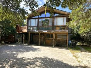 a large wooden house with glass windows on it at SS303- Duck Hill in Southern Shores