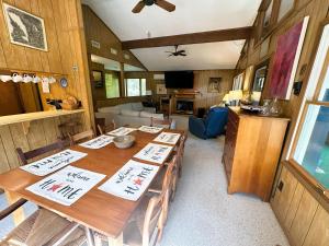a dining room with a table in a house at SS303- Duck Hill in Southern Shores