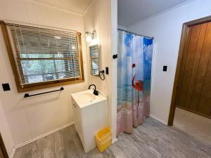 a bathroom with a sink and a shower at SS303- Duck Hill in Southern Shores +16 photos