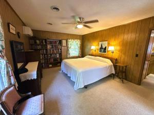 a bedroom with a bed and a ceiling fan at SS303- Duck Hill in Southern Shores