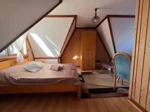 En eller flere senge i et værelse på Pokoje Janka Gliczarów Górny