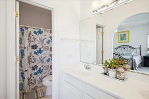 a bathroom with a sink and a mirror at SS3 - Bella Luna in Southern Shores +51 photos