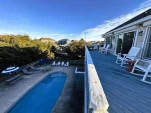 a deck with a swimming pool on a house at KH101 - Shells in Kitty Hawk