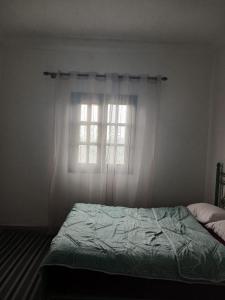 En eller flere senge i et værelse på Villa DOODA superbe vue sur l'Atlas