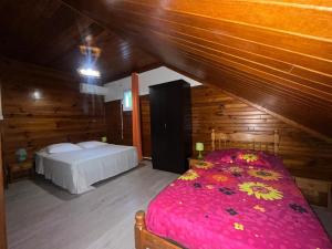 En eller flere senge i et værelse på Résidence Roxelle