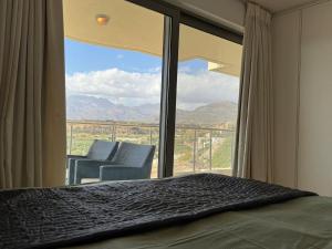 a bedroom with a bed and a large window at Luxury Lagada Loft Sea Views in Pilalímata +61 photos
