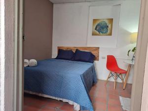 Postel nebo postele na pokoji v ubytování Hostal Genoveva