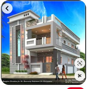 twee mensen die voor een huis lopen bij Shree Radha Bhavan in Heṭauḍā