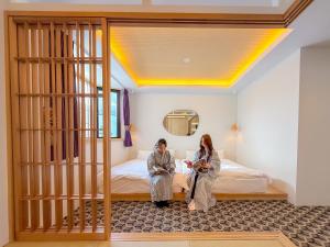 Postel nebo postele na pokoji v ubytování Hotel Imagine Kyoto