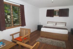 Postel nebo postele na pokoji v ubytování Evis Resort at Nggatirana Island
