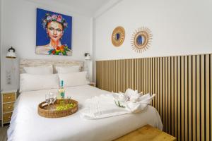 Giường trong phòng chung tại Casita Santa Bárbara - Alicante