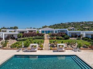 a villa with a swimming pool and a resort at Amazing Views Villa in Loulé