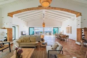 a large living room with a couch and a table at Amazing Views Villa in Loulé