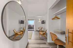 a hallway with a mirror and a living room at Amazing Views Villa in Loulé