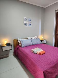 En eller flere senge i et værelse på Vista Mar Incrível