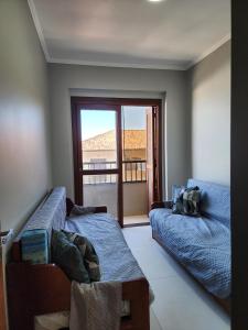 En eller flere senge i et værelse på Vista Mar Incrível