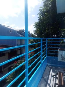 a view from a balcony with blue railing at dragon des iles in Pointe-à-Pitre