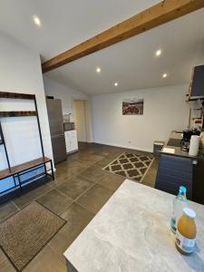 a large room with a kitchen and a counter at Waldeck in Wadgassen