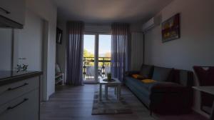 a living room with a couch and a table at Apartman Lana in Plitvička Jezera