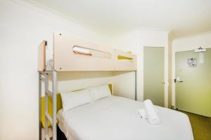 Postel nebo postele na pokoji v ubytování Imperial Motel Windsor
