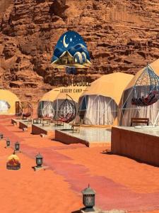 a exhibit at the walt disney world unhappy camp at RAM HORlZON BUBBLE LUXURY CAMP in Wadi Rum +43 photos