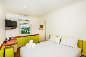 Postel nebo postele na pokoji v ubytování Imperial Motel Windsor