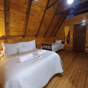 En eller flere senge i et værelse på Estalagem Refúgio do Capão